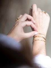 Schakelarmband twisted goud - LEEF mode en accessoires