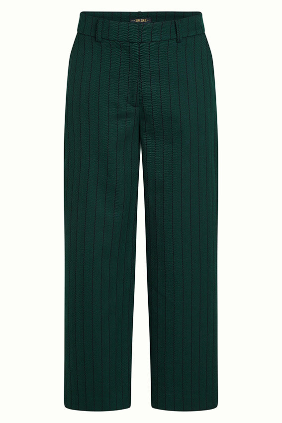 Groene Federica Dale Chevron broek van King Louie, met chevron patroon en comfortabele pasvorm, getoond op model.