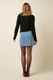 Lila Garbo rok van King Louie in Birch Cord-stof met wijde pasvorm en elastische taille, zichtbaar in de afbeelding.