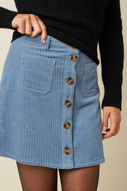 Lila Garbo rok van King Louie met Birch Cord-stof, elegante taille en vloeiende pasvorm, zichtbaar in de afbeelding.