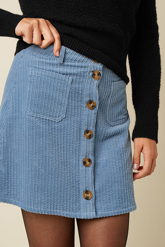 Lila Garbo rok van King Louie met Birch Cord-stof, elegante taille en vloeiende pasvorm, zichtbaar in de afbeelding.