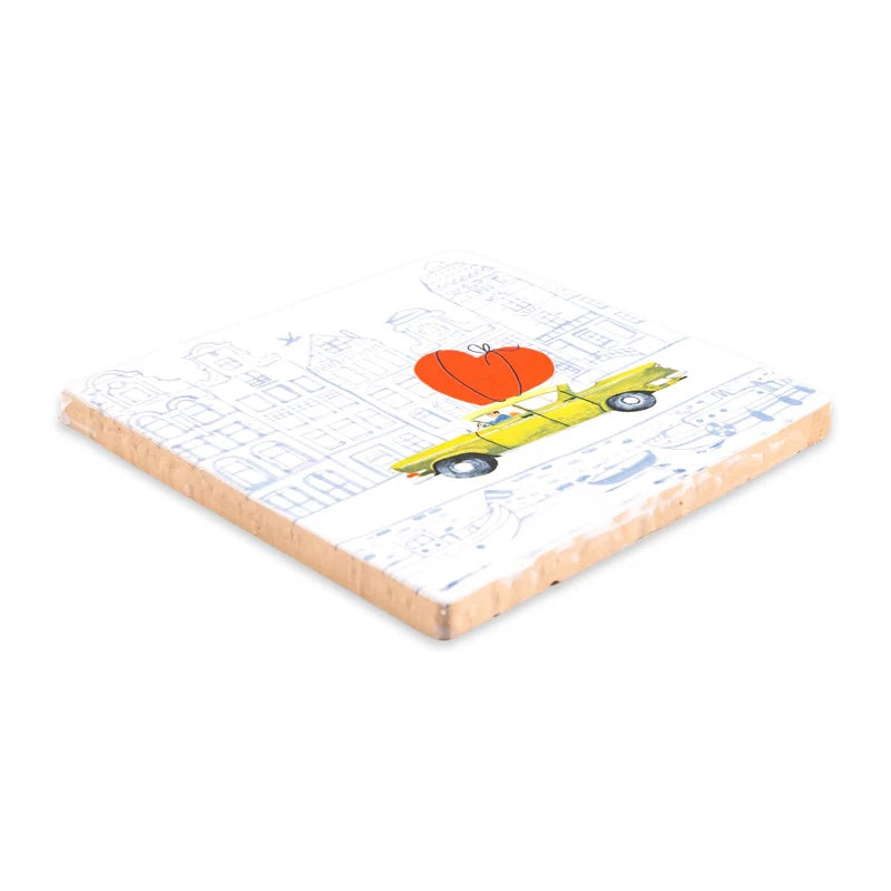 Decoratieve tegel met de tekst "Love is on the way" van StoryTiles, 10x10cm, met een witte achtergrond en zachte letters.