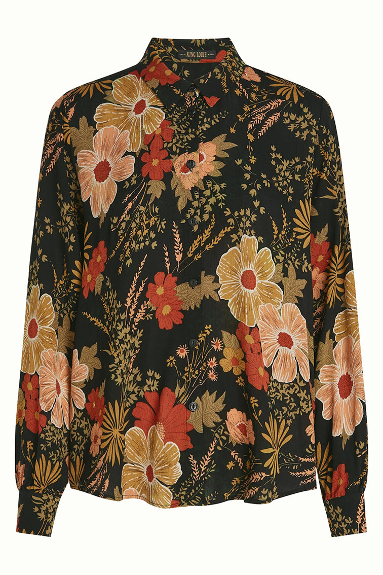 Zwarte Maisie blouse van King Louie met elegante pasvorm en subtiele details, gedragen door een model.