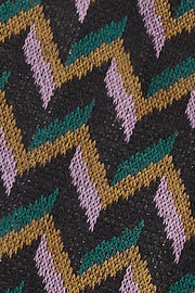 Goudbruine Mirelle handschoen van King Louie met zachte stof en elegante afwerking, zichtbaar in de afbeelding.