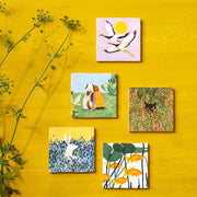 Decoratief muurpaneel van StoryTiles met het ontwerp 'We Stick Together', 10x10 cm, bestaande uit kleine tegels met samengevoegde patronen.